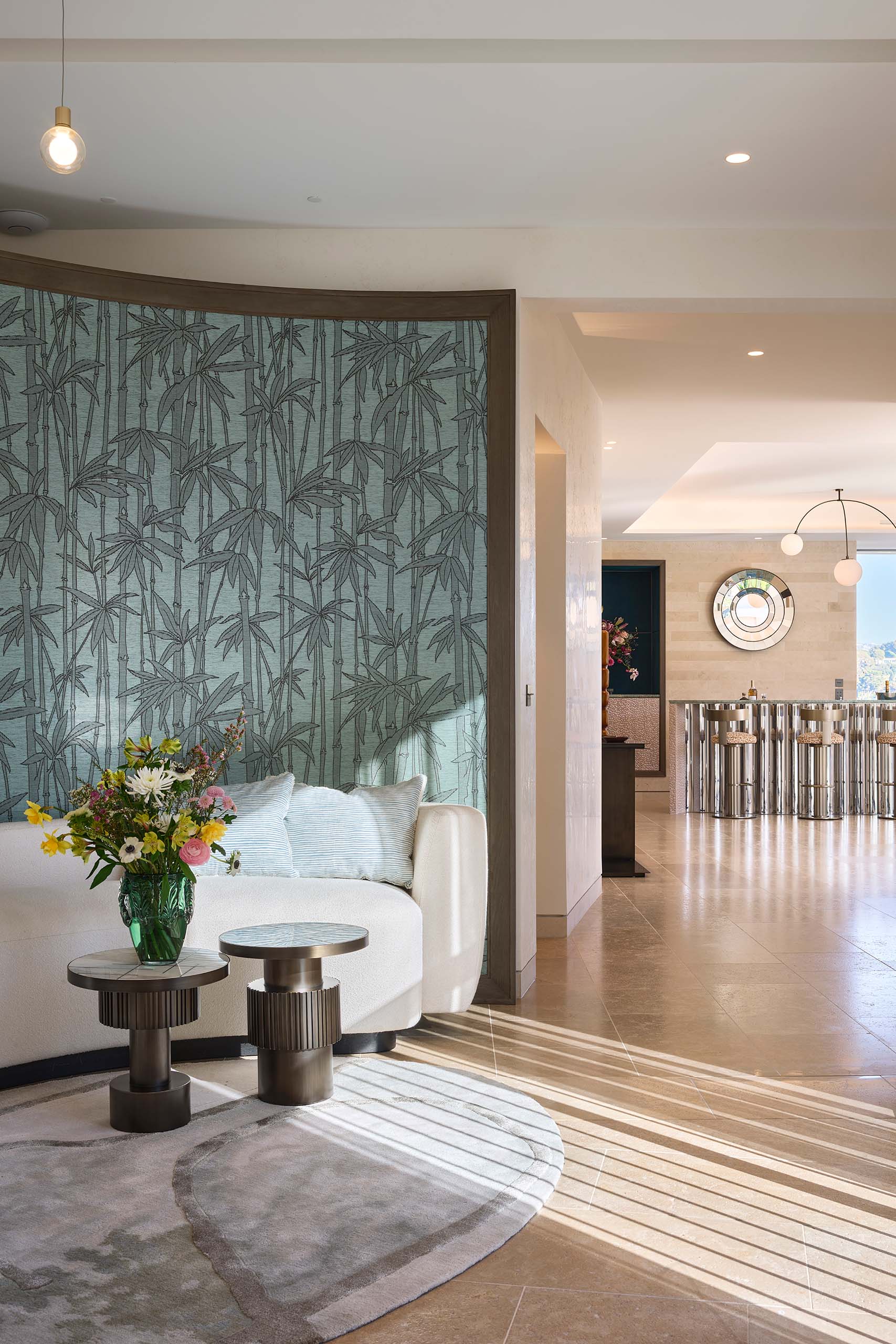 Villa entrance hall at Domaine de la Belle Étoile with bamboo wallpaper feature wall and view through to the bar