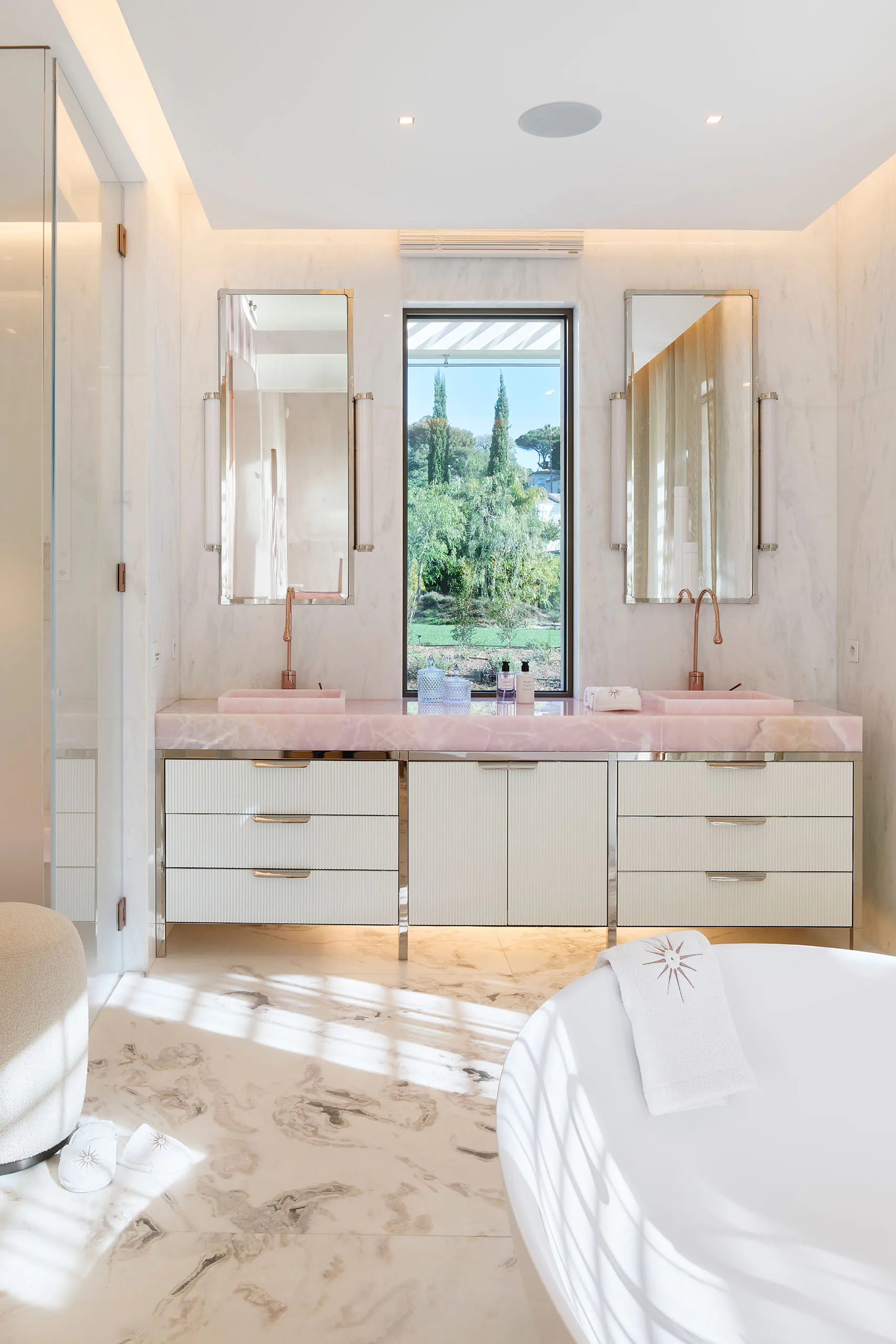 Master en-suite bathroom at Domaine de la Belle Étoile with pink marble double vanity, copper taps and freestanding bath