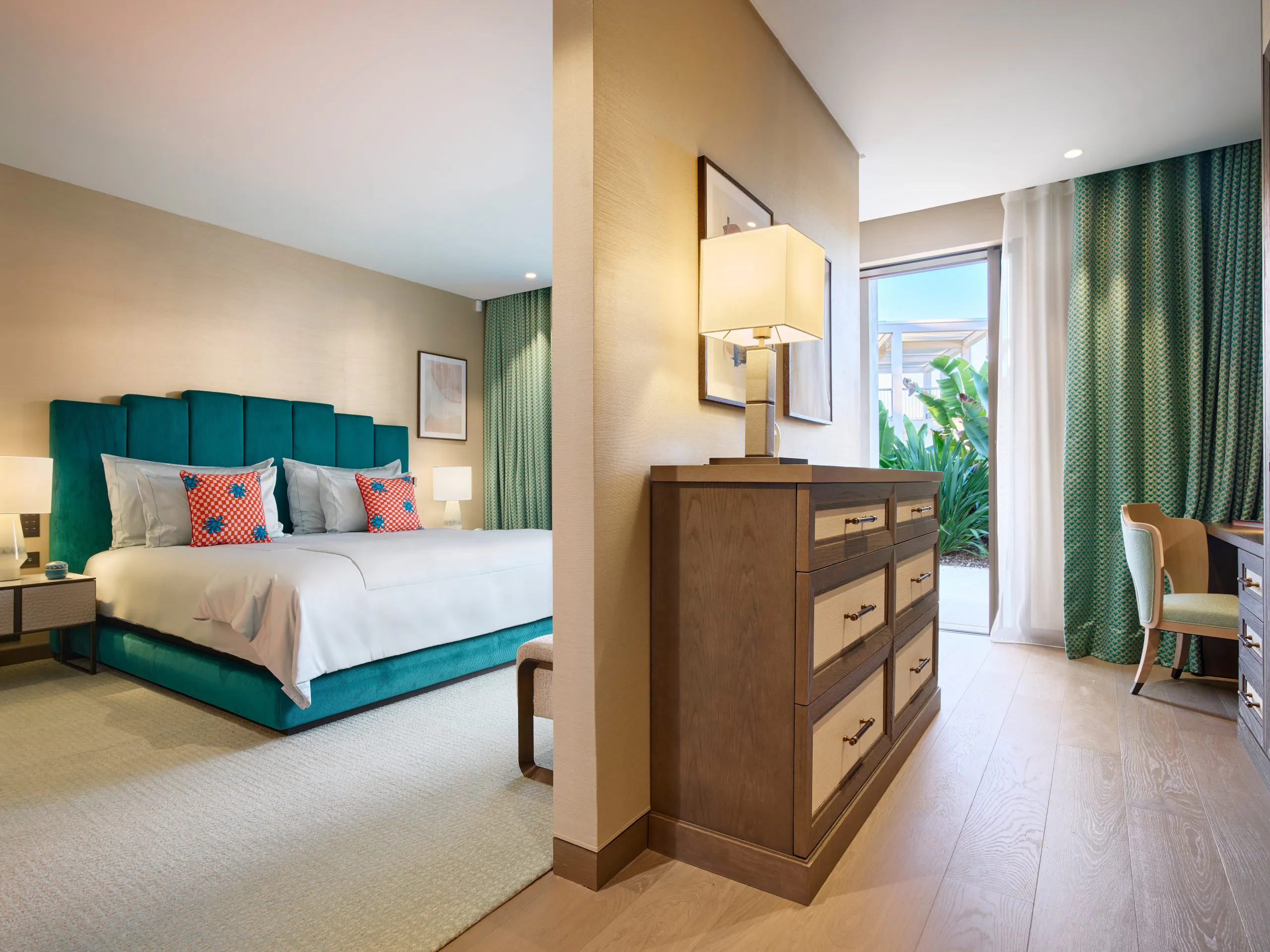 Luxury bedroom suite at Domaine de la Belle Étoile with teal velvet headboard and private garden view